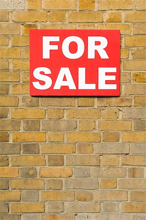 simsearch:614-02243866,k - For sale sign on wall Foto de stock - Royalty Free Premium, Número: 614-02240616