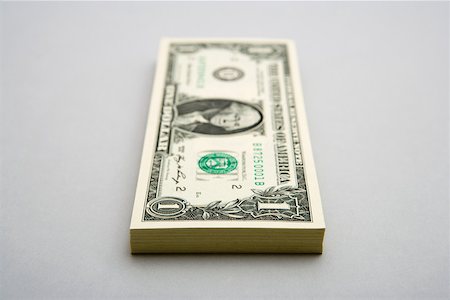 simsearch:614-02242302,k - Stack of one dollar bills Foto de stock - Sin royalties Premium, Código: 614-02240769