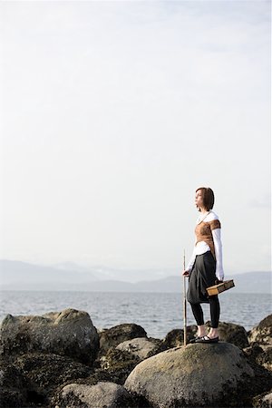 fishing winter - Young woman on rocks by the sea Stock Photo - Premium Royalty-Free, Code: 614-02240976