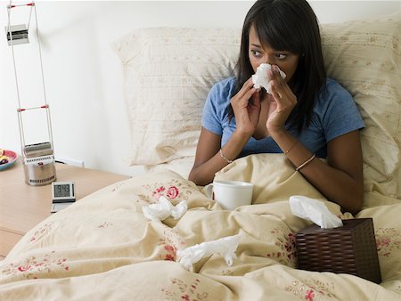 sick african american - Woman in bed with cold Stock Photo - Premium Royalty-Free, Code: 614-02241413