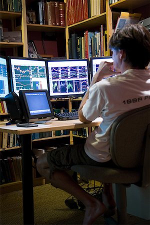 row of monitors - Man looking at graphs Stock Photo - Premium Royalty-Free, Code: 614-02241496