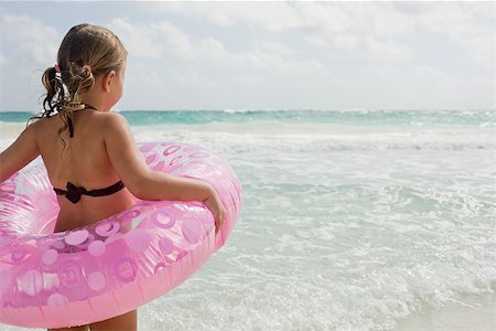 A girl holding a rubber ring Stock Photo - Premium Royalty-Free, Code: 614-02242076