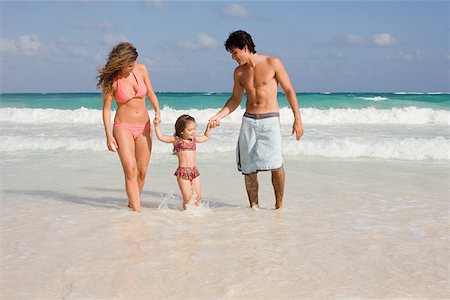A family walking in the sea Stock Photo - Premium Royalty-Free, Code: 614-02242097