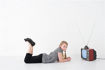 retro child watching tv - Girl with television Stock Photo - Premium Royalty-Free, Code: 614-02242148