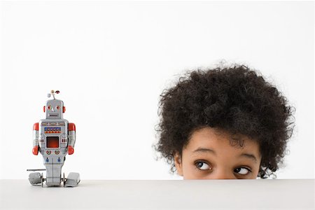 Boy looking at robot Stock Photo - Premium Royalty-Free, Code: 614-02242152