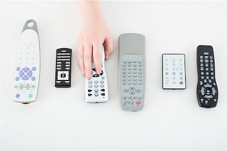 remote control, white background - Child with remote controls Stock Photo - Premium Royalty-Free, Code: 614-02242162