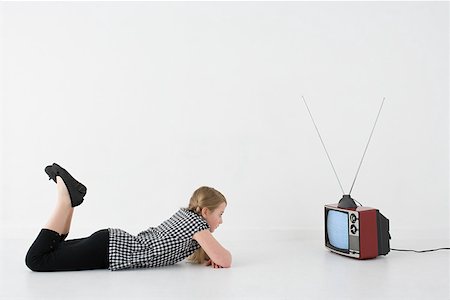 retro child watching tv - Girl watching television Stock Photo - Premium Royalty-Free, Code: 614-02242207