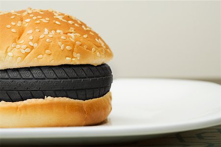 A tyre in a burger Stock Photo - Premium Royalty-Free, Code: 614-02242272