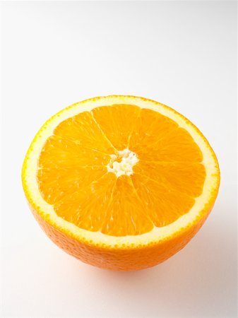 fruit smelling - Orange half Stock Photo - Premium Royalty-Free, Code: 614-02242323