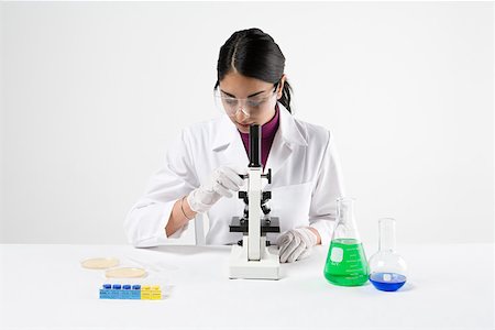 Scientist with microscope Stock Photo - Premium Royalty-Free, Code: 614-02242865