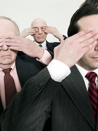 Businessmen covering eyes Fotografie stock - Premium Royalty-Free, Codice: 614-02243329