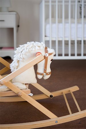 parenting nobody - Rocking horse in bedroom Stock Photo - Premium Royalty-Free, Code: 614-02243517