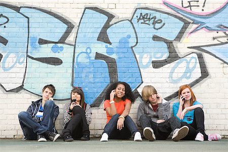 phone lines - Teenagers on cellphones Stock Photo - Premium Royalty-Free, Code: 614-02243658