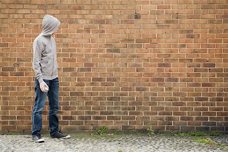 rebel not children - Boy by wall with spray can Stock Photo - Premium Royalty-Free, Code: 614-02243751