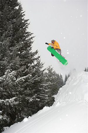 snowboarder jumping - A man snowboarding Stock Photo - Premium Royalty-Free, Code: 614-02243948