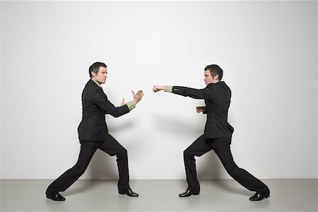 puñetazos - Businessman fighting himself Foto de stock - Sin royalties Premium, Código: 614-02258943