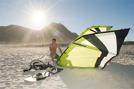 Man with kiteboard Stock Photo - Premium Royalty-Free, Code: 614-02259123