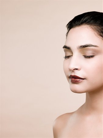 simsearch:614-07031690,k - A young woman with her eyes closed Stock Photo - Premium Royalty-Free, Code: 614-02343585