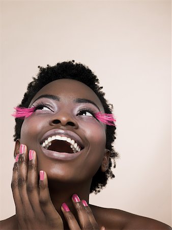 phoney smile - A woman wearing pink false eyelashes Stock Photo - Premium Royalty-Free, Code: 614-02343587