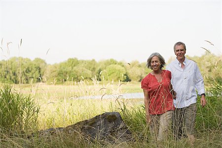 Mature couple in field Stock Photo - Premium Royalty-Free, Code: 614-02394390