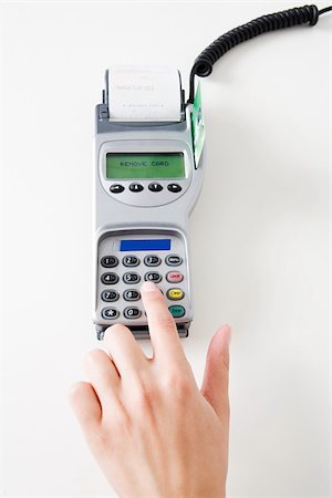 push button - Woman using a chip and pin machine Stock Photo - Premium Royalty-Free, Code: 614-02392326