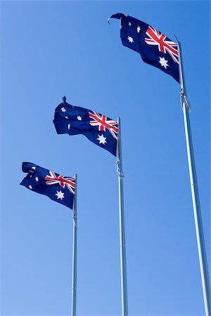 flag pole row - Australian flags Stock Photo - Premium Royalty-Free, Code: 614-02392695