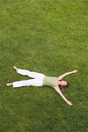 sleeping backyard - Woman lying on grass Stock Photo - Premium Royalty-Free, Code: 614-02392903