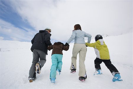 father and son skiing - Family in the snow Stock Photo - Premium Royalty-Free, Code: 614-02393395