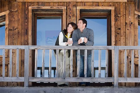 Couple at chalet Stock Photo - Premium Royalty-Free, Code: 614-02393416