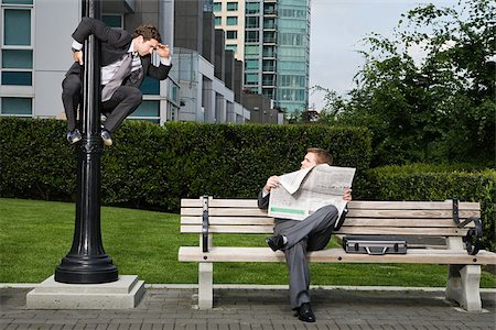 people reading city - Businessman spying on colleague Stock Photo - Premium Royalty-Free, Code: 614-02393557