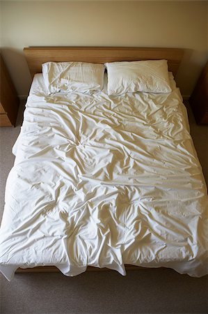Unmade bed Stock Photo - Premium Royalty-Free, Code: 614-02393863