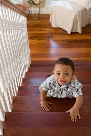 A boy climbing stairs Stock Photo - Premium Royalty-Free, Code: 614-02612200