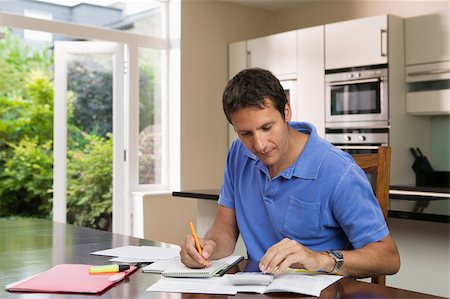 personal finance - Man with paperwork Stock Photo - Premium Royalty-Free, Code: 614-02612683