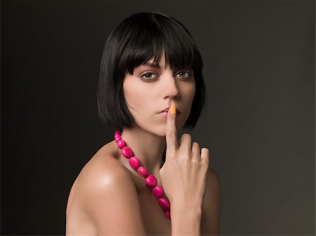 Woman with finger on lips Foto de stock - Sin royalties Premium, Código: 614-02613073