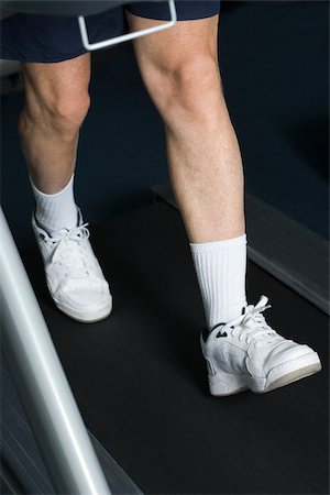 people walking tennis shoes - Mature man walking on a treadmill Stock Photo - Premium Royalty-Free, Code: 614-02613968
