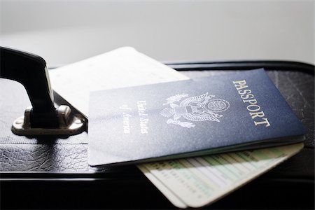 passport - Briefcase tickets and a passport Stock Photo - Premium Royalty-Free, Code: 614-02639687