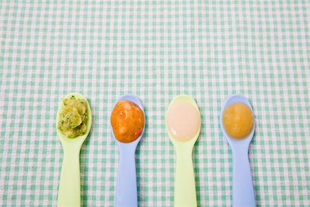 pureed - Baby food on spoons Stock Photo - Premium Royalty-Free, Code: 614-02639857