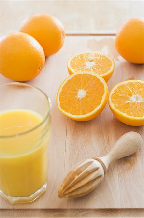 spremiagrumi a mano - Orange juice Fotografie stock - Premium Royalty-Free, Codice: 614-02639954
