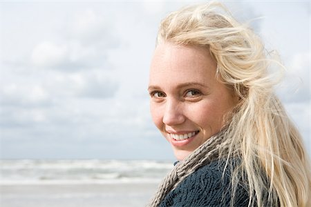 Young woman at the coast Stock Photo - Premium Royalty-Free, Code: 614-02640049