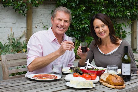 seniors dining - Mature woman and senior man dining al fresco Stock Photo - Premium Royalty-Free, Code: 614-02640100