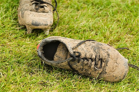 Muddy football boots Foto de stock - Sin royalties Premium, Código de la imagen: 614-02640265