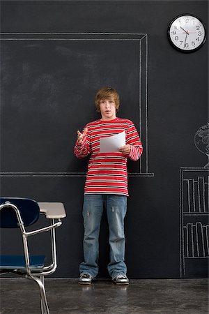 A boy giving a presentation Stock Photo - Premium Royalty-Free, Code: 614-02640680