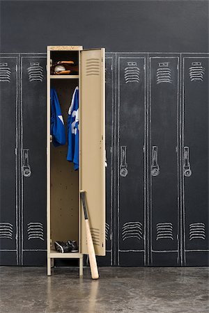 Baseball uniform hanging in a closet Stock Photo - Premium Royalty-Free, Code: 614-02640690