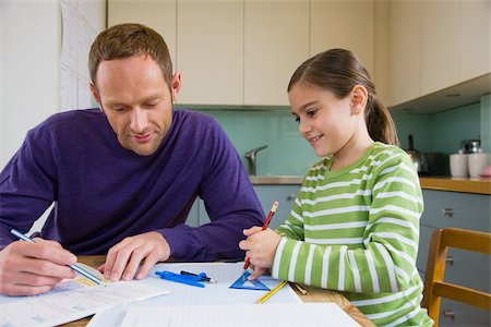 simsearch:614-02640837,k - Father helping his daughter with homework Stock Photo - Premium Royalty-Free, Code: 614-02640787