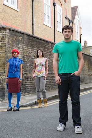 Young people standing in street Stock Photo - Premium Royalty-Free, Code: 614-02640934