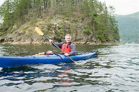 Kayak dans le fjord de l'homme Photographie de stock - Premium Libres de Droits, Code: 614-02679035