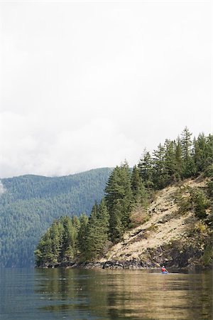 Person kayaking in fjord Stock Photo - Premium Royalty-Free, Code: 614-02679057