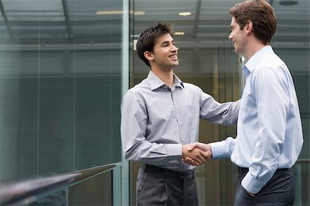 simsearch:614-02679072,k - Colleagues shaking hands Stock Photo - Premium Royalty-Free, Code: 614-02679091