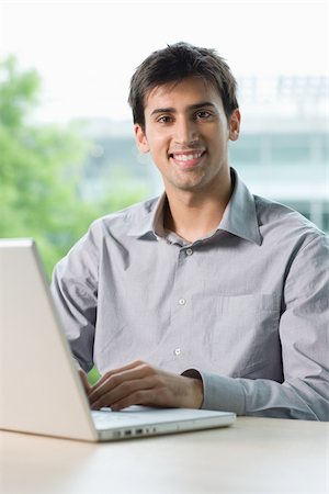 simsearch:614-02679072,k - Office worker with laptop Stock Photo - Premium Royalty-Free, Code: 614-02679105