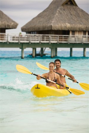 Couple in canoe in bora bora Foto de stock - Sin royalties Premium, Código: 614-02679664